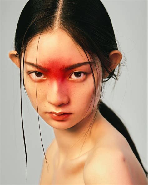a woman with red paint on her face