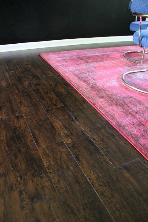 NuCore is a luxury vinyl flooring that looks like hardwood but is waterproof and can be ...