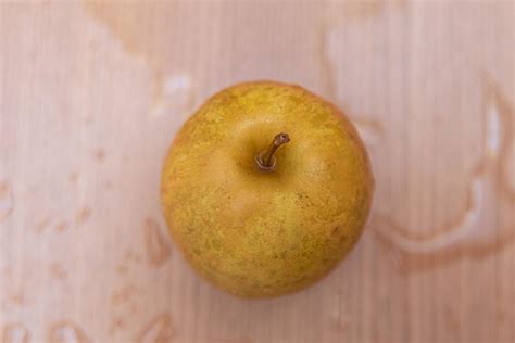 Apple on the wooden table 5500228 Stock Photo at Vecteezy