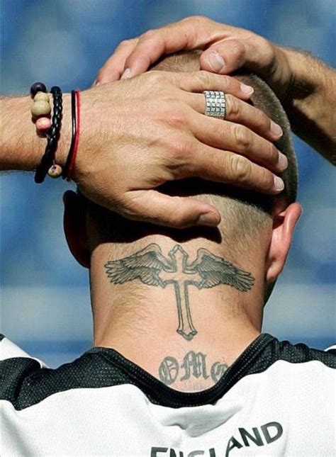 David Beckham Winged cross tattooed in David Beckhams... Cross Tattoo ...