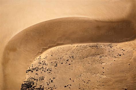 Aerial view of Barchan Dunes, Suguta Valley, Kenya. Changes in elevation lead to a huge ...