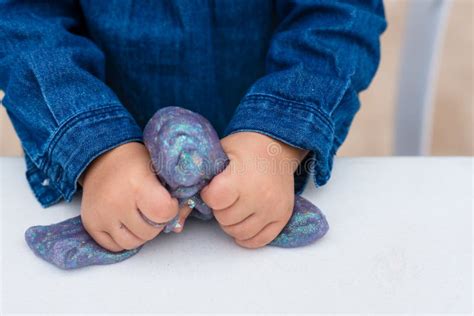 Process of Making Slime. Blue Magic Glitter Slime on a White Background ...