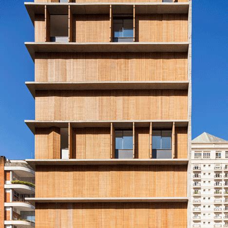 Perforated wooden shutters allow the residents of this São Paulo ...