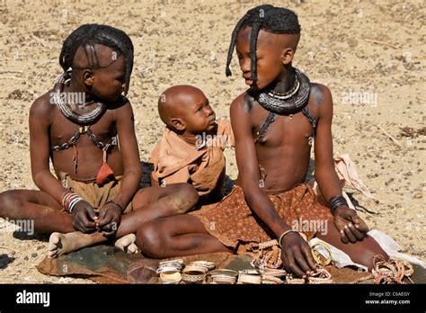 Himba girls and baby in village near Opuwo, Namibia Stock Photo - Alamy