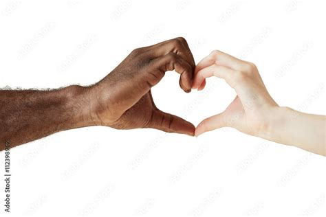 Two people of different races and ethnicities holding hands in the shape of a heart, symbolizing ...