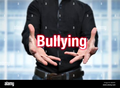 Mobbing, bullying, man holds lettering in the hands Stock Photo - Alamy