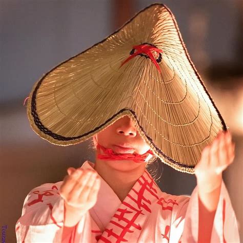 This cone-shaped straw hat is a type of traditional Japanese hat called ...