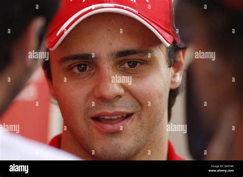 Brazilian Formula One driver Felipe Massa of Ferrari walks through the paddock at Yas Marina ...