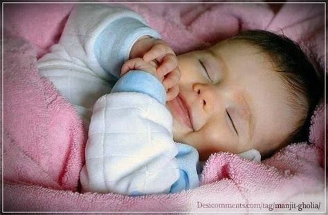 Baby smiling while sleeping - Desi Comments