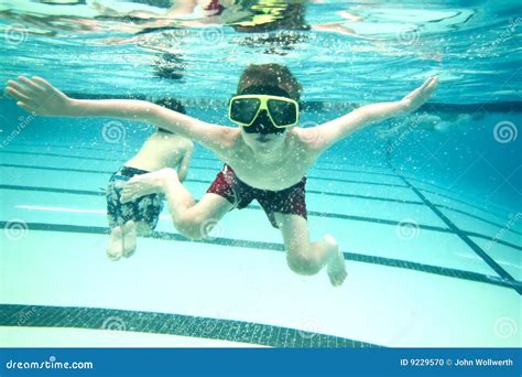 Little Boy Swimming Underwater Stock Photo - Image: 9229570