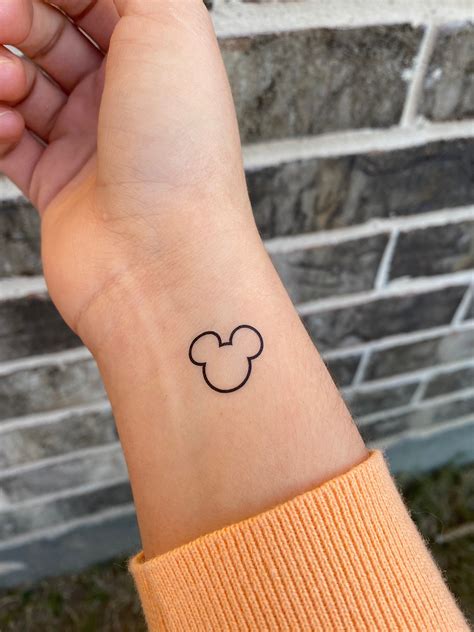 Discover 78+ mickey mouse ears tattoo latest - in.cdgdbentre