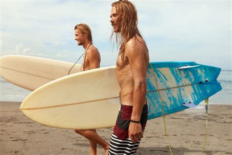 Surfing. Handsome Surfers with Surfboards. Young Men Walking on Ocean Beach. Stock Image - Image ...