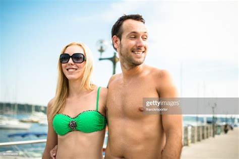 Happy Friends Laughing Together On The Jetty High-Res Stock Photo - Getty Images