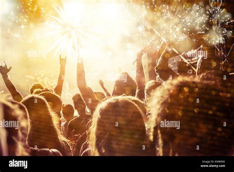 new Year concept - cheering crowd and fireworks Stock Photo - Alamy