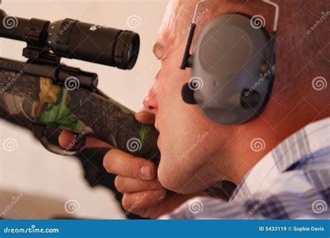 Man shooting rifle. stock image. Image of shot, danger - 5433119