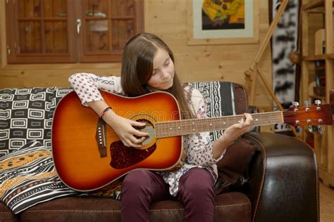 Young Teen Girl Playing Acoustic Guitar Stock Photo - Image of sound, smile: 80970586