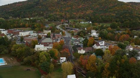 5.5K stock footage aerial video flying over small town, approach Bath-Haverhill Bridge, autumn ...