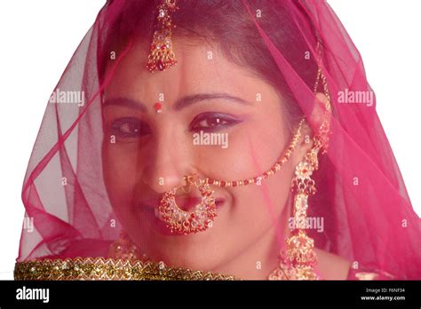 Indian woman wearing gold earrings hi-res stock photography and images - Alamy