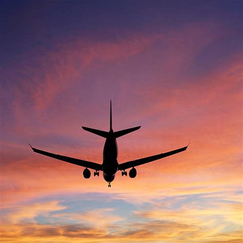 80+ Plane Silhouette Flying In Sky Behind A Vibrant Sunset Stock Photos ...