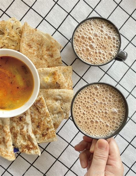 Plain Thosai and its varieties Rawa Thosai and Uttapam served with Teh Tarik (bubble tea) Stock ...