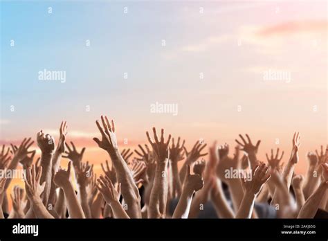 Crowd Of People Raising Hands At Celebration Event Stock Photo - Alamy