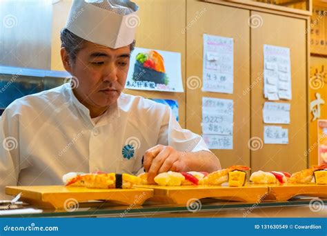 Unidentified Japanese Sushi Chef Prepares Dishes of Japanese ...