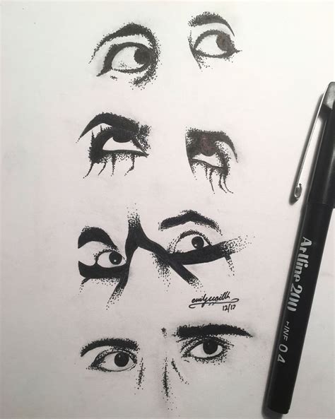 the eyes are drawn on paper with a pen