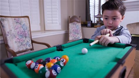 6 Year-old billiard prodigy playing with a mini pool table - YouTube