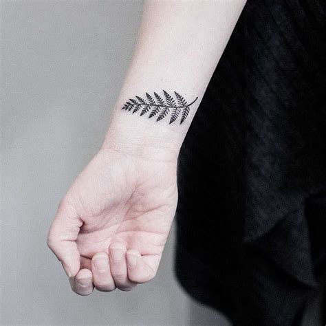 Small fern leaf tattoo on the wrist - Tattoogrid.net