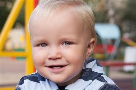 Premium Photo | Smiling child outdoors in playground portrait