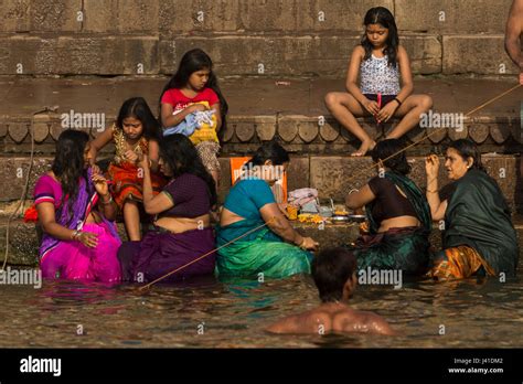 Women bathing in the sacred waters of the Ganges river. Varanasi, India Stock Photo - Alamy