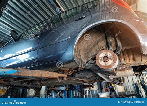 Car Suspension Maintenance. Vehicle on the Auto Repair Service Lift Stock Image - Image of ...