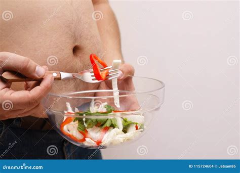 Overweight Man Eating Salad. Guy with Obese Belly Tasting Vegeta Stock ...