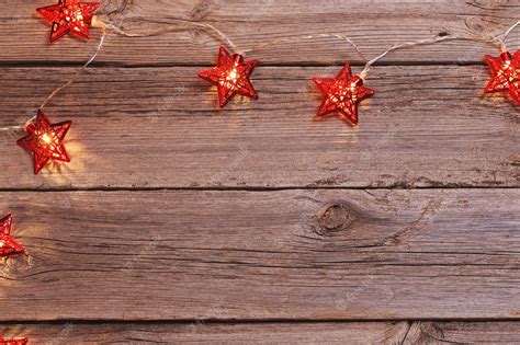 Premium Photo | Christmas lights on wooden background