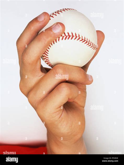 Hand holding baseball ball, close up Stock Photo - Alamy