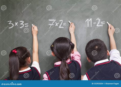 Three School Children Doing Math Equations on the Blackboard Stock Photo - Image of elementary ...