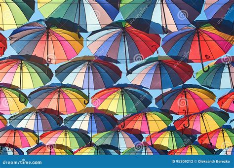 Rainbow Colored Umbrellas Over the Street Stock Photo - Image of green ...