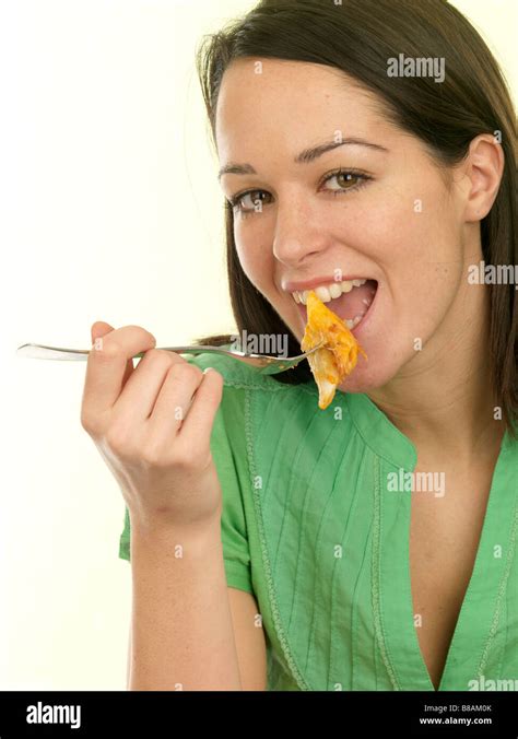 Young Woman Eating Pasta Bake Model Released Stock Photo - Alamy