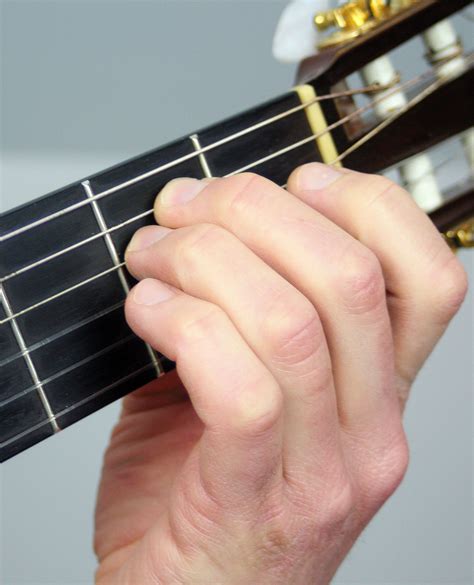 How to Play an E Minor Chord - Notes on a Guitar