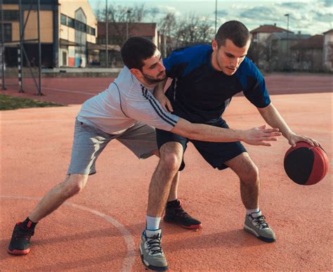 Two basketball players playing basketball - Discovery Eye Foundation