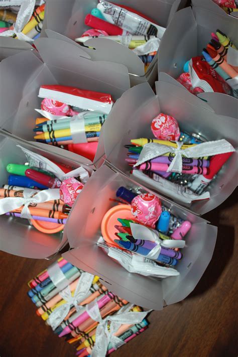 several plastic containers filled with markers and pencils