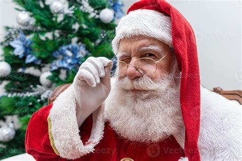 Santa Claus looking at the camera. Christmas is coming. Merry Christmas ...