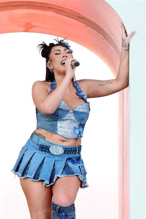 Kali Uchis Performs at Coachella 2023 in D&G Butterfly Denim Boots – Footwear News