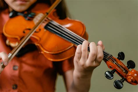 Person Playing Violin in Close Up Photography · Free Stock Photo