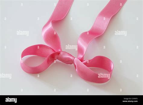 Pink satin ribbon Stock Photo - Alamy