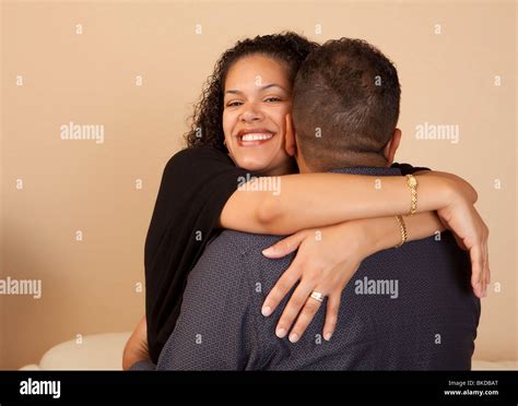 Wife Hugging Her Husband Stock Photo - Alamy