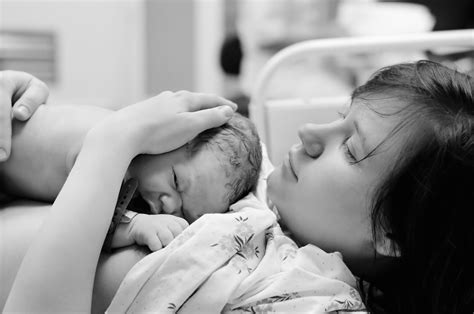 Woman with newborn baby right after delivery – Oh Mother Care Kits