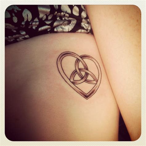 Ripped skin celtic knot tattoo with heart - Google Search | Knot tattoo ...