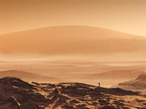 Olympus Mons. On Mars a lone astronaut from Earth explores the area around the volcano Olympus ...