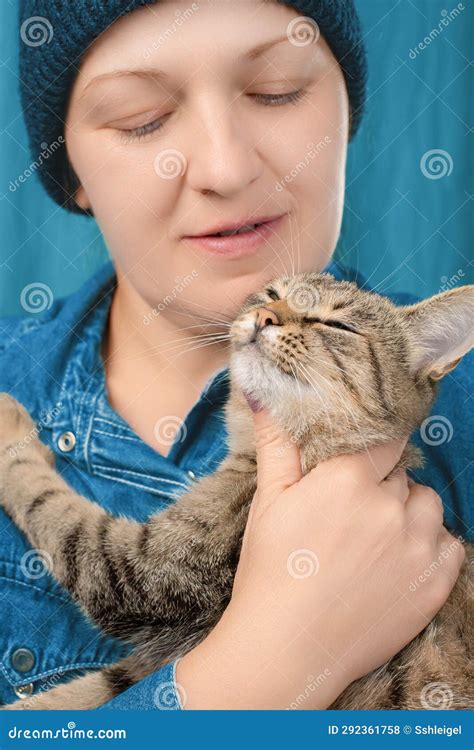 Caucasian Woman Hugs and Strokes a Tabby Cat. Front View Stock Photo ...
